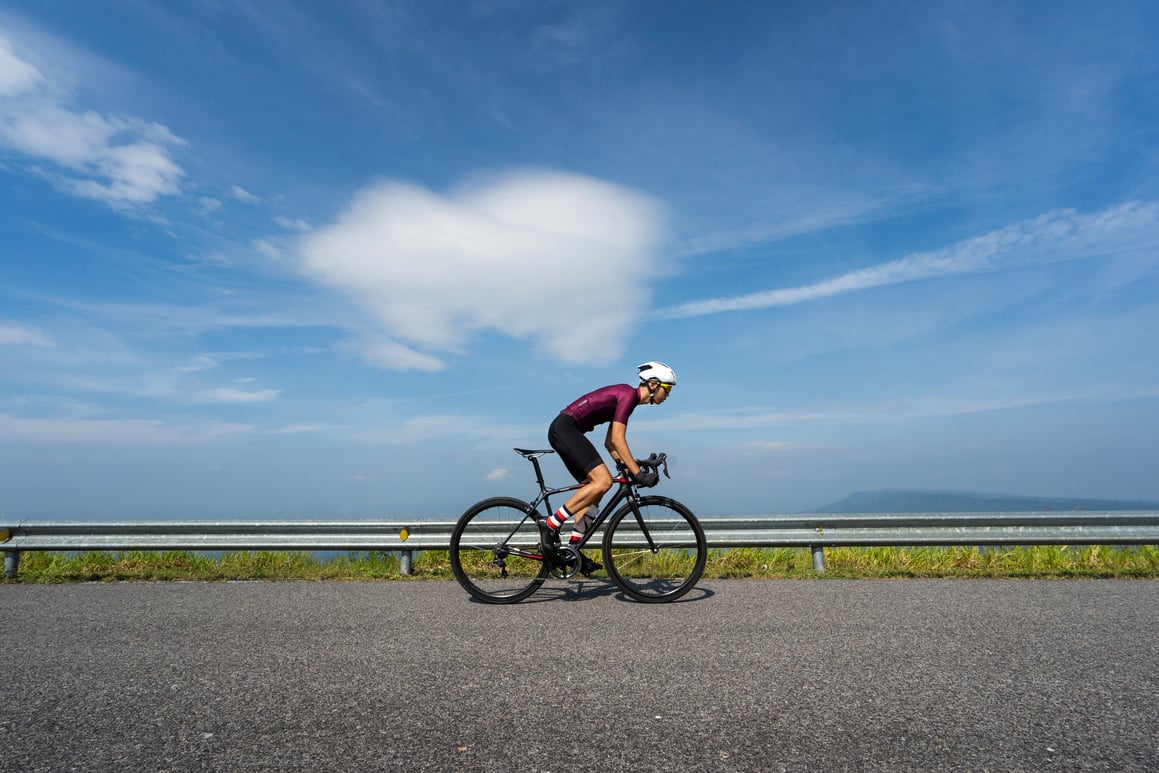 Asian man cycling road bike in the morning