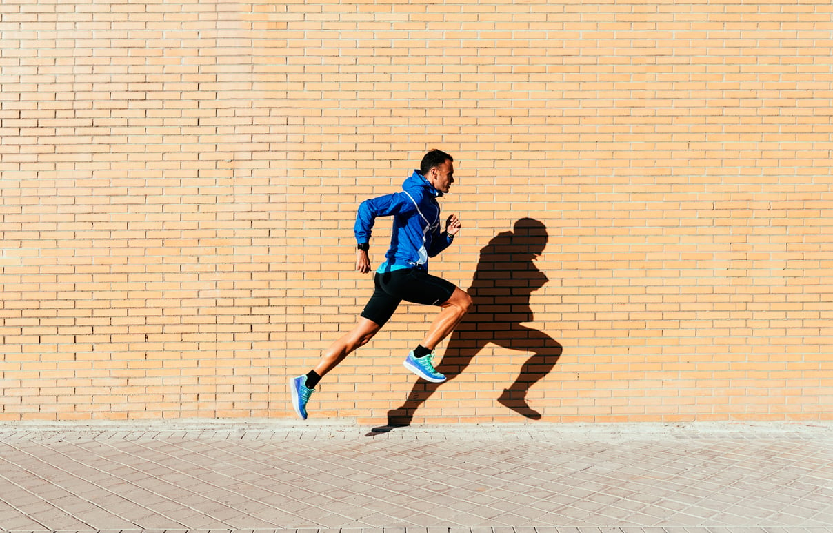 Handsome man running in the city.